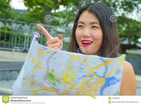 Lifestyle Close Up Portrait of Young Happy and Beautiful Asian Korean Tourist Woman on Street ...