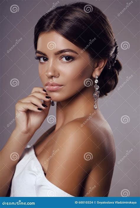 Beautiful Young Tanned Girl With Dark Hair With Bijou Stock Photo - Image: 60010324