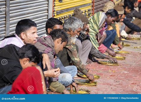 Poor Indian People Eating Free Food at the Street in Varanasi, India Editorial Stock Image ...