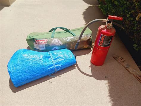 COLEMAN 5 PERSON TENT, BLUE TARP AND FIRE EXTINGUISHER | EstateSales.org