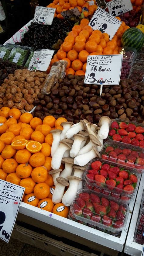 an assortment of fruits and vegetables for sale