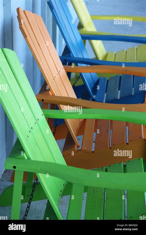 Row of colorful chairs Stock Photo - Alamy