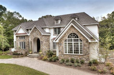 European Style Home with Natural Thin Stacked Stone | Stone siding house, Stucco and stone ...