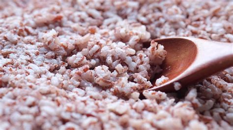 Cooked whole rice, red grains 13483262 Stock Video at Vecteezy