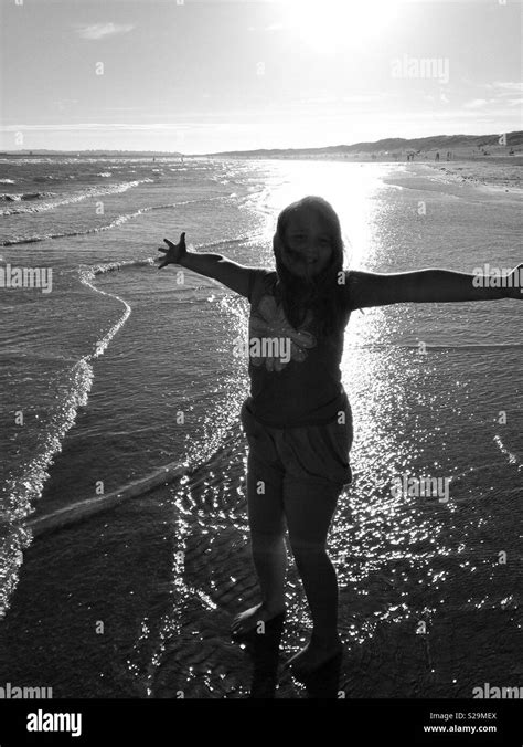 Silhouette of a girl at the beach Stock Photo - Alamy