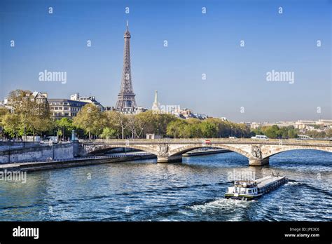 Famous Eiffel Tower with boat on Seine in Paris, France Stock Photo - Alamy