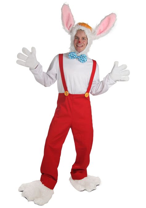 a man in bunny ears and overalls is posing for the camera