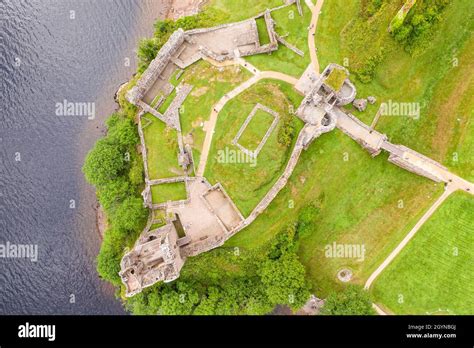 Aerial view Urquhart Castle, a ruin, sits beside Loch Ness in the ...