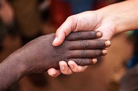 Black And White Holding Hands Stock Photo - Download Image Now - iStock