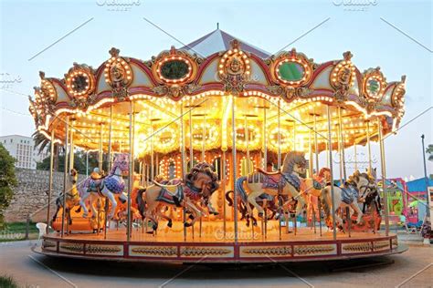 Vintage carousel at night | High-Quality Arts & Entertainment Stock Photos ~ Creative Market