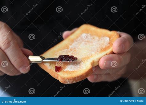 Man Prepares Buttered Toast with JamÂ Â Stock Photo - Image of tasty ...