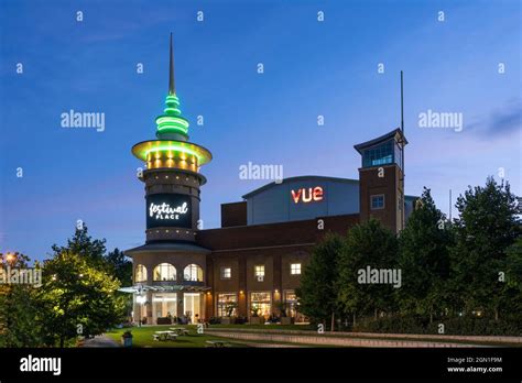 A distinctive illuminated tower of Festival Place shopping centre, Vue Cinema and the Angel Bar ...