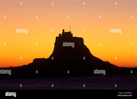 Sunrise over Lindisfarne Castle, Holy Island, Northumberland Stock ...