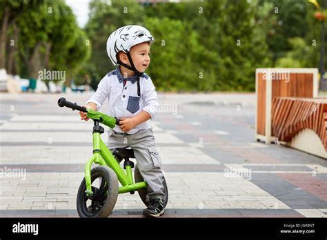 boy in a helmet riding bike Stock Photo - Alamy