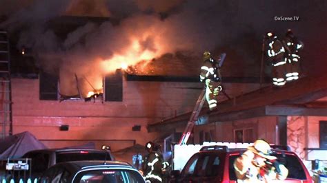 Tustin house fire spreads; 6 people displaced - ABC7 Los Angeles