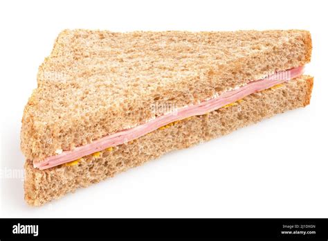 Ham and mustard wholewheat triangle sandwich isolated on white Stock ...