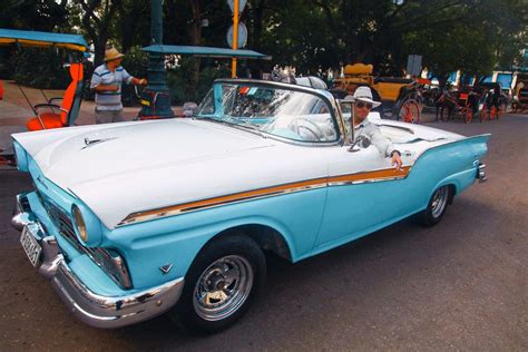 A Man Driving a Vintage Car · Free Stock Photo