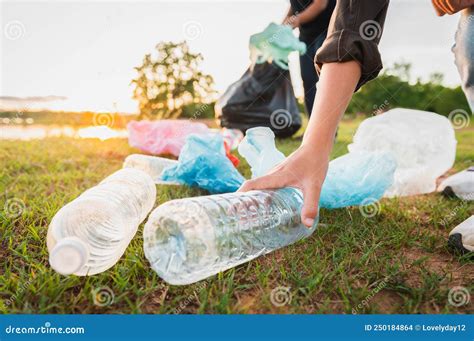 Woman Hand Picking Up Garbage Plastic Bottle for Cleaning at Park Stock ...