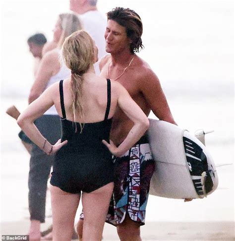 Ellie Goulding's romance with hunky surfing instructor heats up! Singer looks cosy with Armando ...