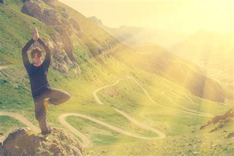 Premium Photo | Woman doing yoga in the mountains