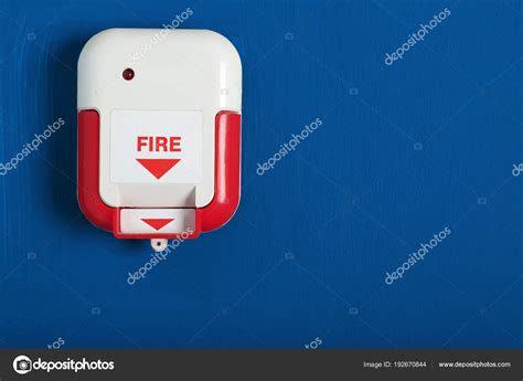 Manual fire alarm pull station on wall indoors — Stock Photo © serezniy ...