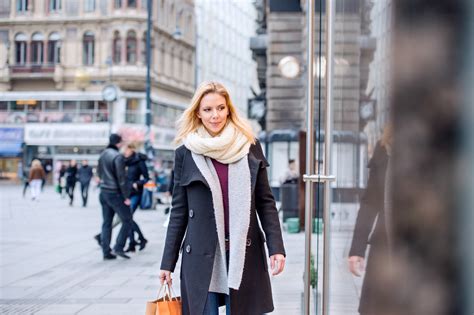 Beautiful young woman window shopping in historical centre of the city of Vienna, Austria ...