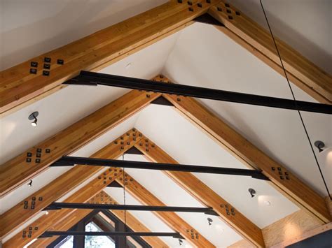 steel collar ties support the weight of the roof and paired with glue laminated wood beams offer ...