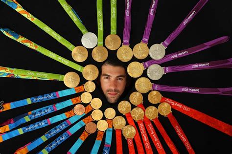 Michael Phelps poses with all 28 of his Olympic medals, 23 of them gold ...