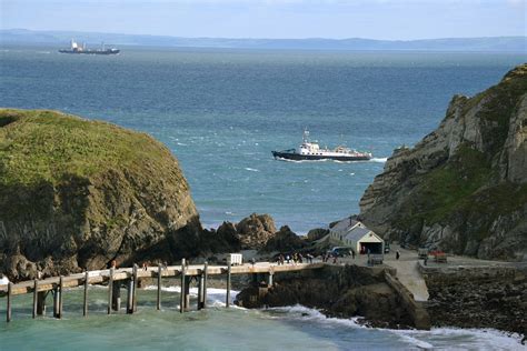 Passengers wait on the Lundy landing jetty for MS Oldenburg, which will ...