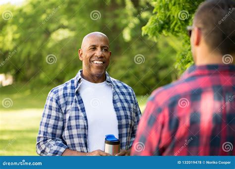 Multi-Ethnic Group of Friends Talking and Camping. Stock Photo - Image of males, talking: 132019478