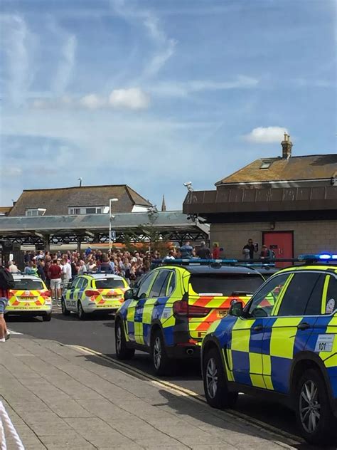 Weymouth police incident: Photos show officers descend on town's train ...