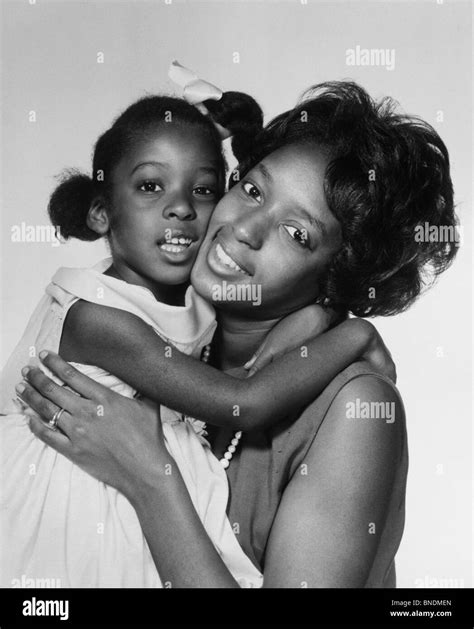 Mother hugging little daughter Stock Photo - Alamy