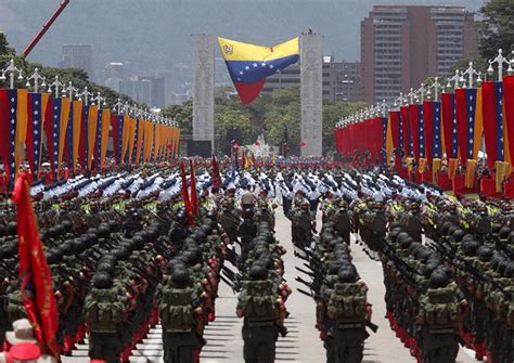 Venezuelan soldiers in Caracas parade along the Walk of Heroes for ...