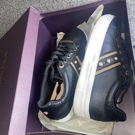 Kurt Geiger Women's Black and Gold Trainers | Depop