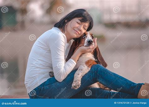 Happy Woman Hugging Her Dog Basset Hound Stock Photo - Image of ...