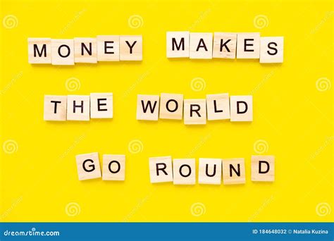 Sayings Money Makes the World Go Round on Yellow Background. Stock Photo - Image of flow, goal ...