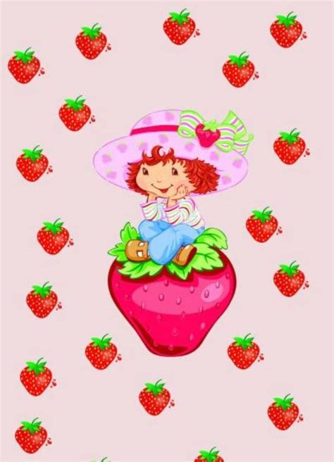 Download Strawberry Shortcake Sitting On Strawberry Wallpaper | Wallpapers.com