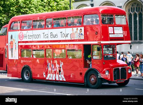 A red Routemaster bus in London providing afternoon tea bus tours by ...