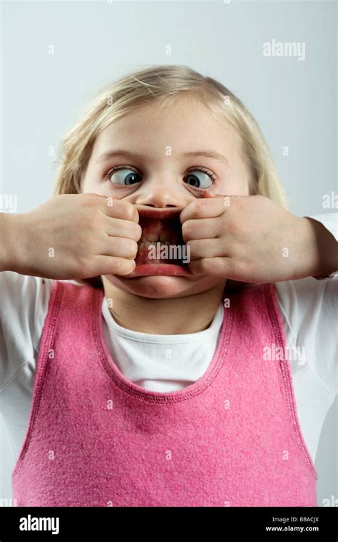 A little girl making a scary face Stock Photo - Alamy