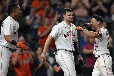 Altuve hits grand slam in 10th, Astros rally past Rangers | AP News