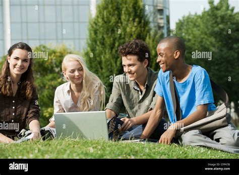 University students studying together on grass Stock Photo - Alamy
