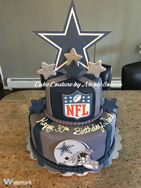 a football themed birthday cake with a star on the top and an nfl logo ...