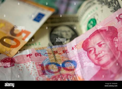 Berlin, Germany. 27th Apr, 2023. A Chinese 100 yuan banknote (front), a 1 U.S. dollar bill (M ...