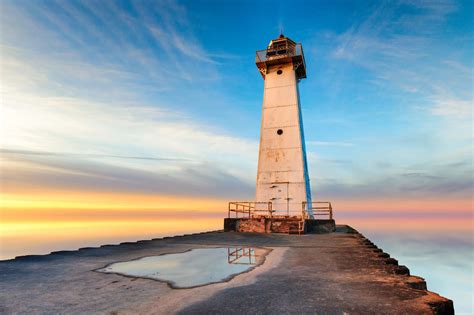 Sodus Point Lighthouse on the southern shore of Lake Ontario, at sunset. | Floating lights, Lake ...