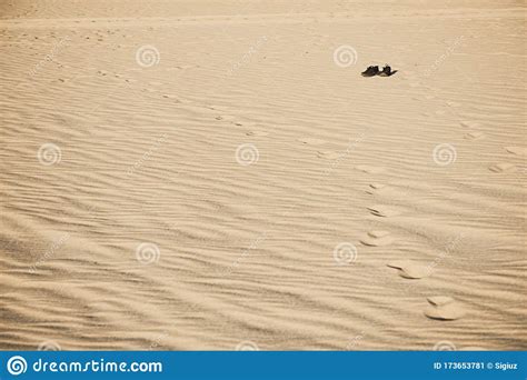 Old Used Black Boots Lie Half Buried in Desert Sand Dune Under Clear Sunny Sky Stock Image ...