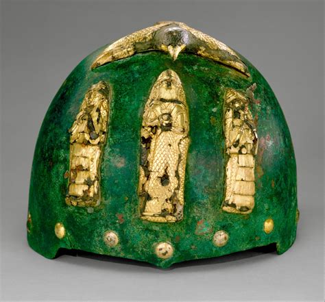 Helmet with divine figures beneath a bird with outstretched wings - Middle Elamite period ...