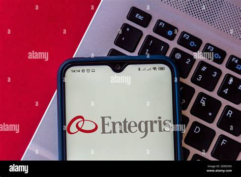 In this photo illustration the Entegris logo seen displayed on a smartphone Stock Photo - Alamy