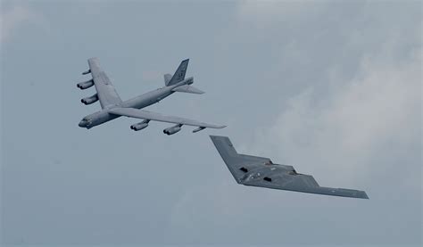 A United States Air Force (USAF) B-52 Stratofortress heavy bomber and a USAF B-2 Spirit heavy ...