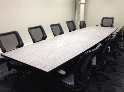 A large conference table complete with power outlets and USB ports. | Custom cabinetry, Large ...