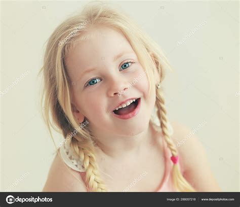 Beautiful Smiling Little Girl Looking Camera — Stock Photo © lenanet ...